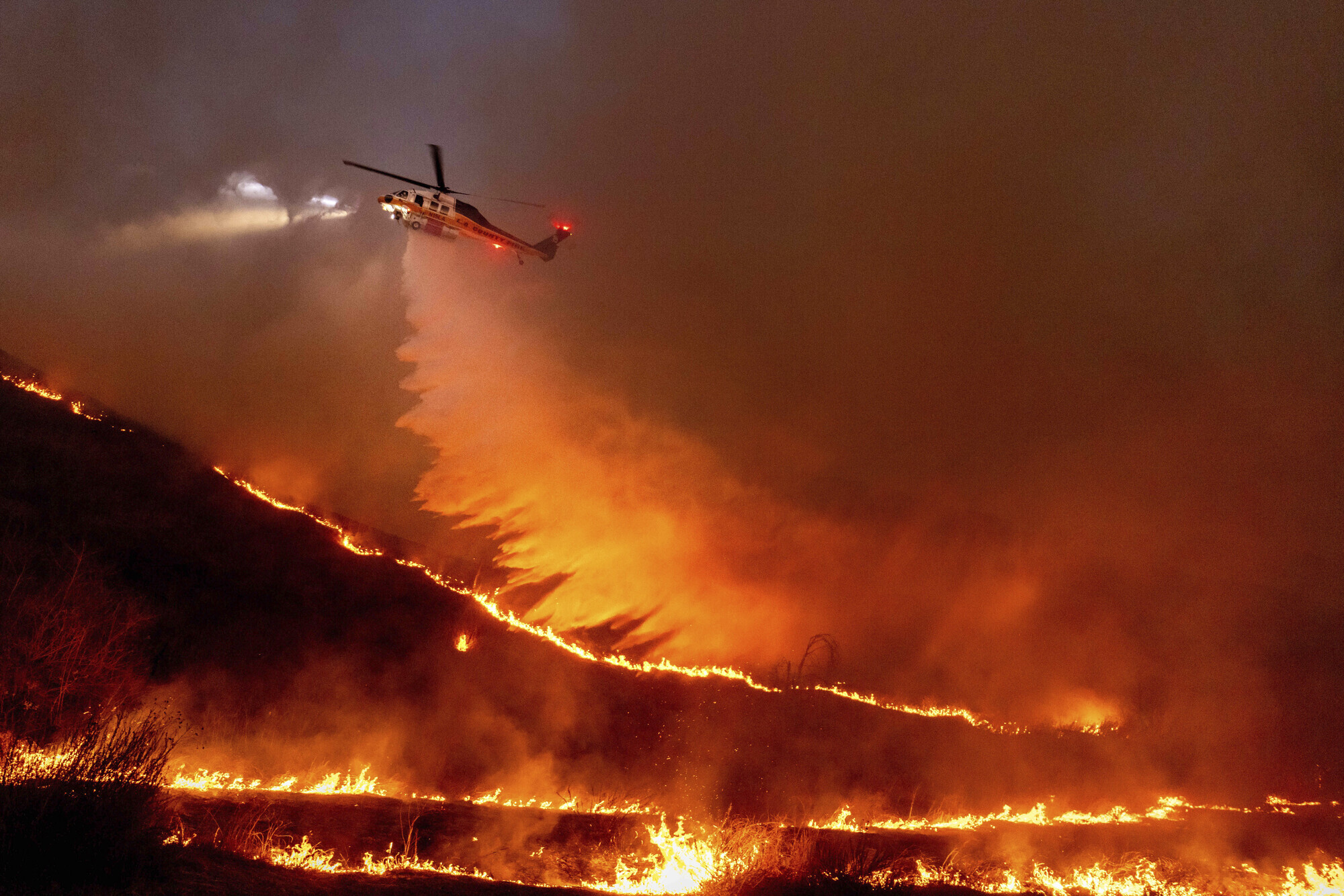 New LA-area fire prompts more evacuations with more than 10,000 structures lost