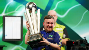 <p>Luke Littler lifts The Sid Waddell Trophy after winning the World Darts Championship final last week. </p>