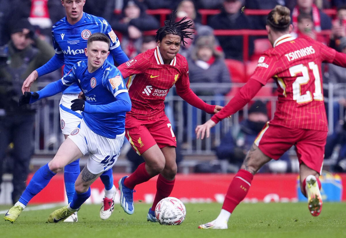 Liverpool's Rio Ngumoha (centre) and Accrington Stanley's Ash Hunter (left) battle for the ball. Picture: Peter Byrne/PA Wire.