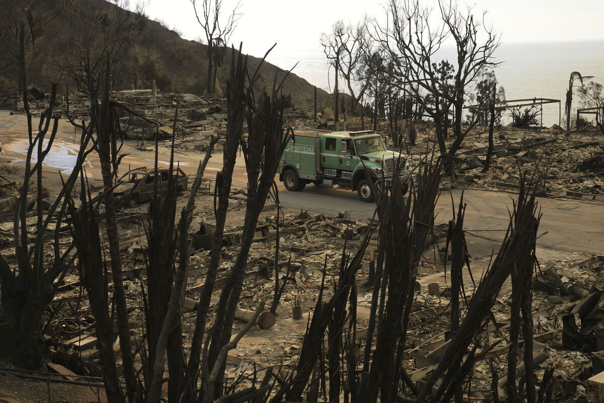 A fire vehicle moves down a street in the aftermath of the Palisades Fire. Picture AP Photo/John Locher A fire vehicle moves down a street in the aftermath of the Palisades Fire. Picture AP Photo/John Locher