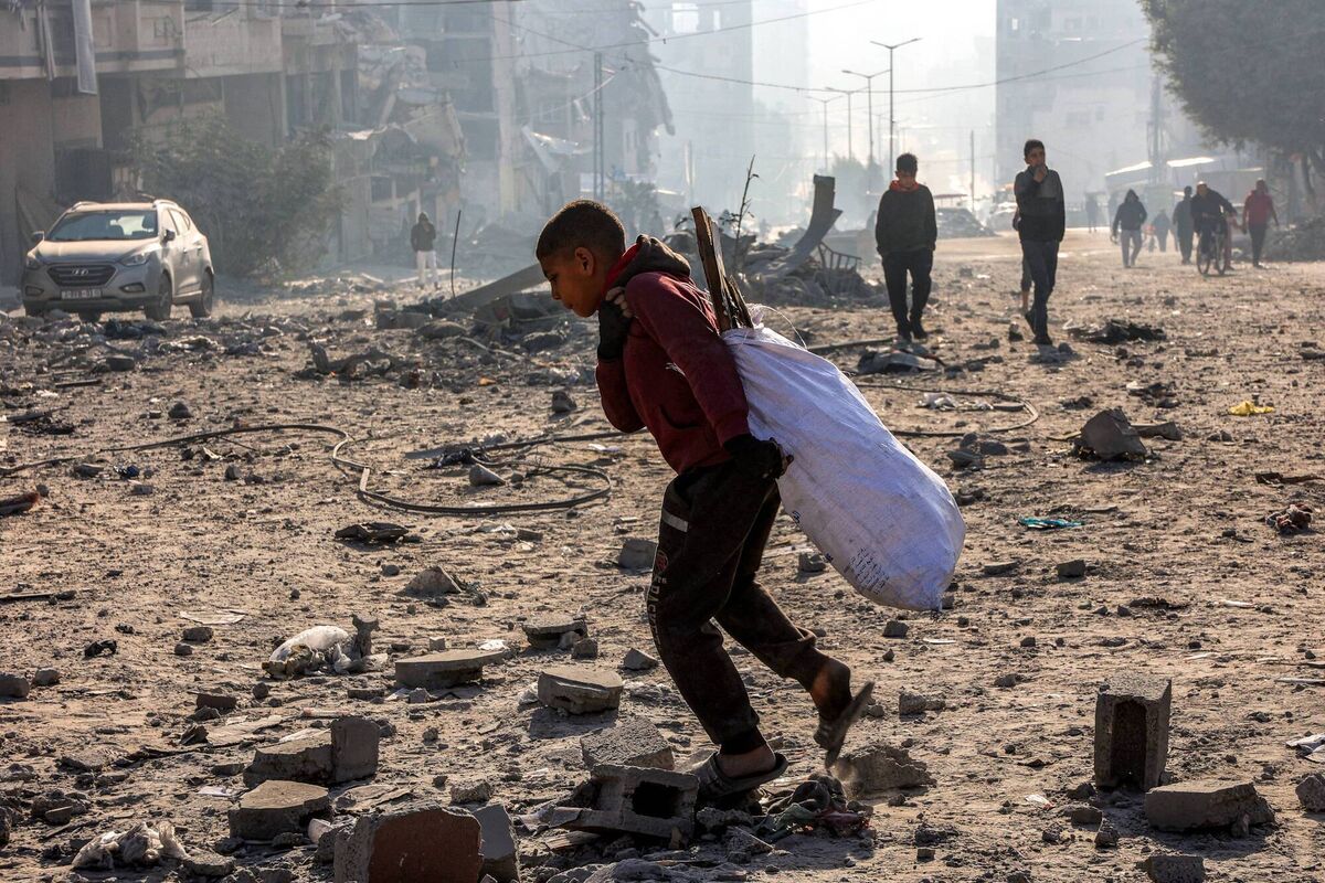 A boy walks with a sack of salvaged items through debris at the site of Israeli bombardment on a residential block in Jalaa Street in Gaza City on January 14, 2025. Picture: OMAR AL-QATTAA/AFP via Getty Images A boy walks with a sack of salvaged items through debris at the site of Israeli bombardment on a residential block in Jalaa Street in Gaza City on January 14, 2025. Picture: OMAR AL-QATTAA/AFP via Getty Images