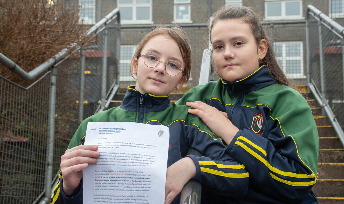 Ukrainian pupils Dana Halytska and Nadiia Melnyk with the letter from the Department of Integration on their notice of eviction from the Quality Hotel in Redbarn, Youghal.