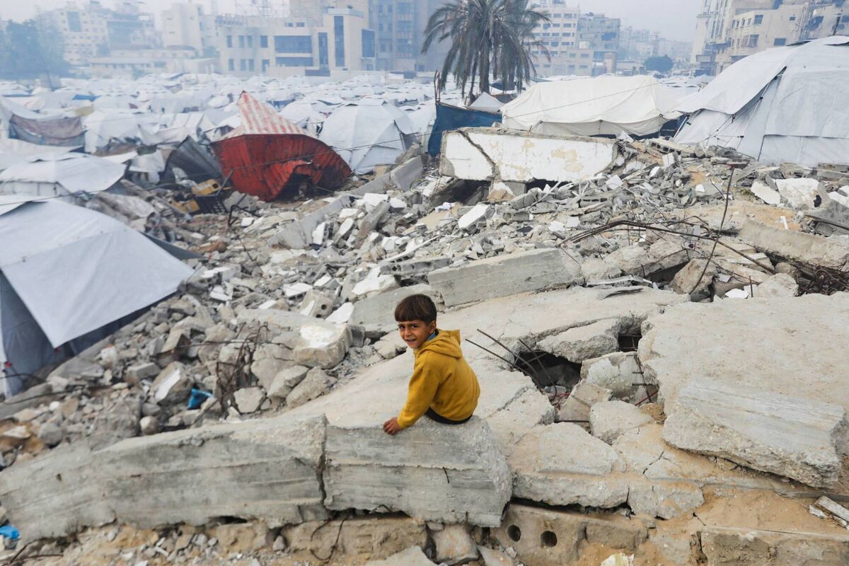 A Palestinian child sits amid the rubble of buildings destroyed in previous Israeli strikes, ahead of a ceasefire set to take effect on Sunday, in Gaza City January 16, 2025. Picture: REUTERS/Mahmoud Issa