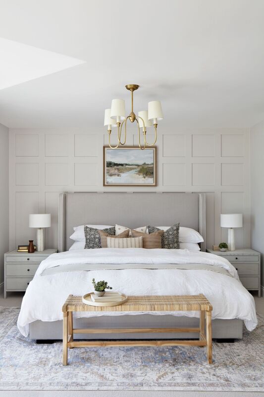 The main bedroom continues the muted colour palette with comfortable textiles. The main bedroom continues the muted colour palette with comfortable textiles.