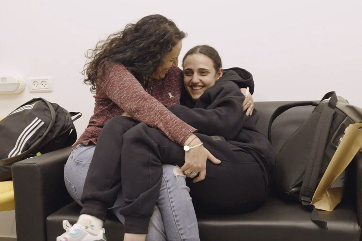 Romi Gonen, right, and her mother Merav hold each other near kibbutz Reim, southern Israel after Romi was released from captivity by Hamas militants in Gaza, Sunday, Jan. 19, 2025. (Israeli Army via AP) Romi Gonen, right, and her mother Merav hold each other near kibbutz Reim, southern Israel after Romi was released from captivity by Hamas militants in Gaza, Sunday, Jan. 19, 2025. (Israeli Army via AP)