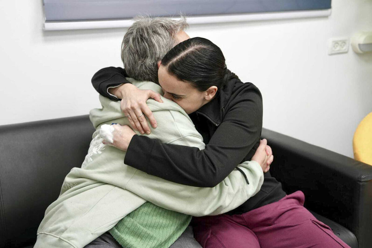 In this photo released by the Israeli Army, Emily Damari, right, and her mother Mandy embrace near kibbutz Reim, southern Israel after Emily was released from captivity by Hamas militants in Gaza, Sunday, Jan. 19, 2025. (Israeli Army via AP) In this photo released by the Israeli Army, Emily Damari, right, and her mother Mandy embrace near kibbutz Reim, southern Israel after Emily was released from captivity by Hamas militants in Gaza, Sunday, Jan. 19, 2025. (Israeli Army via AP)
