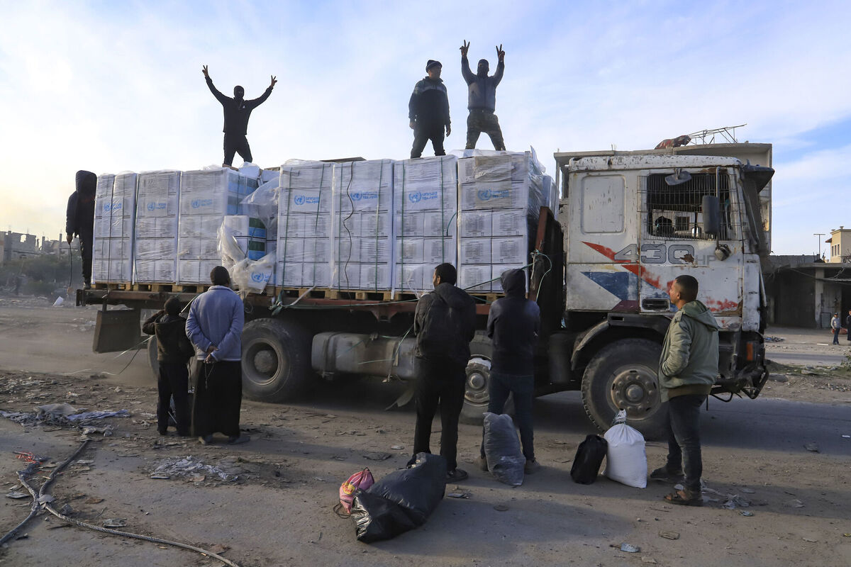 Humanitarian aid trucks enter through the Kerem Shalom crossing from Egypt into the Gaza Strip, as a ceasefire deal between Israel and Hamas went into effect. Picture: AP Photo/Mariam Dagga Humanitarian aid trucks enter through the Kerem Shalom crossing from Egypt into the Gaza Strip, as a ceasefire deal between Israel and Hamas went into effect. Picture: AP Photo/Mariam Dagga