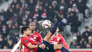 <p>TOPSHOT - Lille's French midfielder Benjamin Andre (C) volleys the ball during the French L1 football match between Lille LOSC and OGC Nice at Stade Pierre-Mauroy in Villeneuve-d'Ascq, northern France on January 17, 2025. (Photo SAMEER AL-DOUMY/AFP via Getty Images)</p>