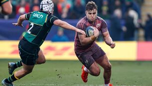 <p>STAYING PUT: Alex Kendellen of Munster is tackled by Curtis Langdon of Northampton Saints. Pic: Matt Impey/Sportsfile</p>
