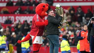 <p>SWEET 18: Luke Littler presents the Sid Waddell Trophy following his win at the World Darts Championship at half time during the Premier League match at Old Trafford. Pic: Martin Rickett/PA Wire.</p>