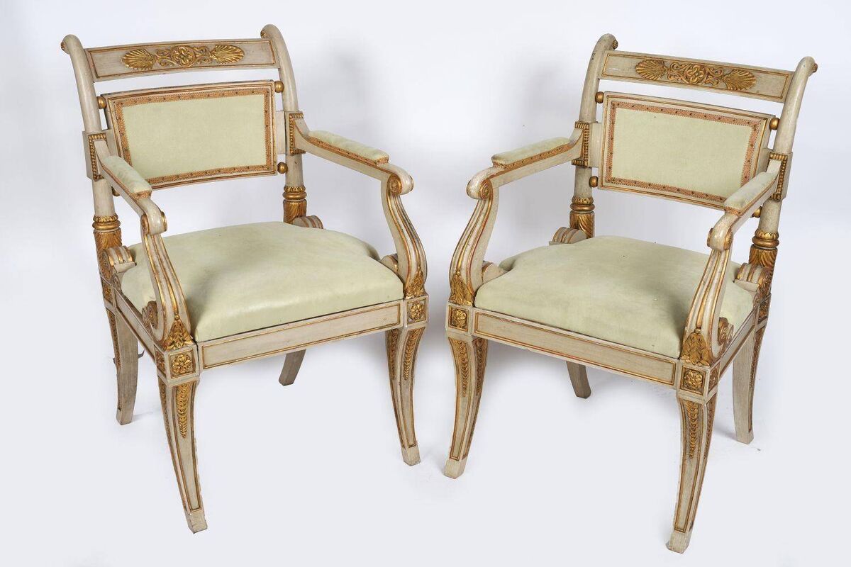 A pair of parcel gilt and painted elbow chairs at Sheppard's.