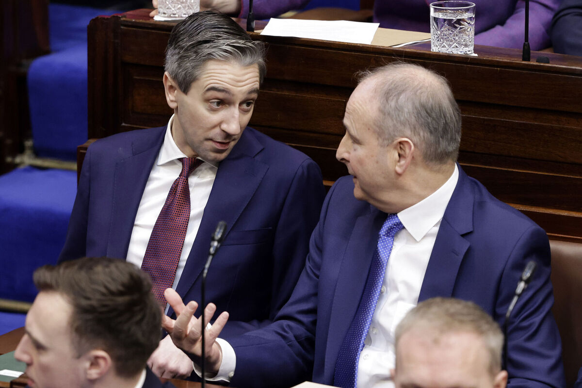 Fine Gael leader, Simon Harris TD (left) and Fianna Fail leader, Micheal Martin in the Dail chamber ahead of the vote on the nomination of Mr Martin as Taoiseach, before futher chaos ensued. Picture: Maxwells
