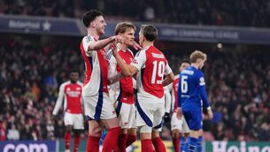 <p>Arsenal's Martin Odegaard (centre) celebrates with team-mates after scoring Arsenal's third and final goal of the evening</p>