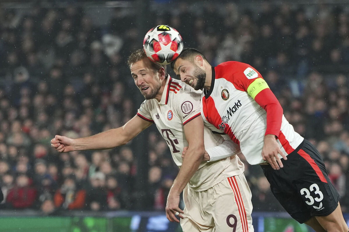 Bayern's Harry Kane, left, duels for the ball with Feyenoord's David Hancko Bayern's Harry Kane, left, duels for the ball with Feyenoord's David Hancko