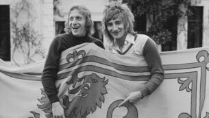 <p>YOUNG TURKS: Denis Law, then of Manchester City, with rock star Rod Stewart, both are holding a Royal Banner of Scotland in 1974. Pic: B. Gomer/Daily Express/Hulton Archive/Getty Images</p>