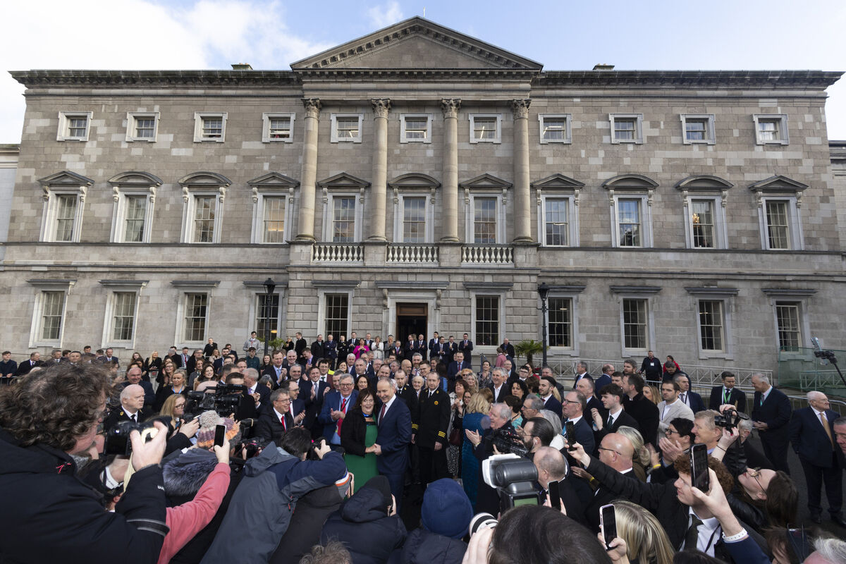 An Taoiseach Micheál Martin with party colleagues from Fianna Fáil with his wife Mary O’Shea at Leinster House after the vote confirming him as Taoiseach. Photo: Sam Boal/Collins Photos 