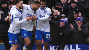 <p>WHITE ON CUE: Rangers' Cyriel Dessers (centre) celebrates with team-mates after scoring their side's third goal. Pic: Andrew Milligan/PA Wire.</p>
