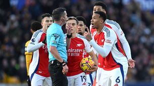 <p>CONTROVERSY: Gabriel of Arsenal and his teammates protest to referee Michael Oliver after Myles Lewis-Skelly of Arsenal (not pictured) is shown a red card for a foul on Matt Doherty. Pic:  Shaun Botterill/Getty Images)</p>