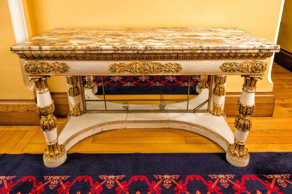 An Italian marble-topped console table at the Victor Mee auction. An Italian marble-topped console table at the Victor Mee auction.