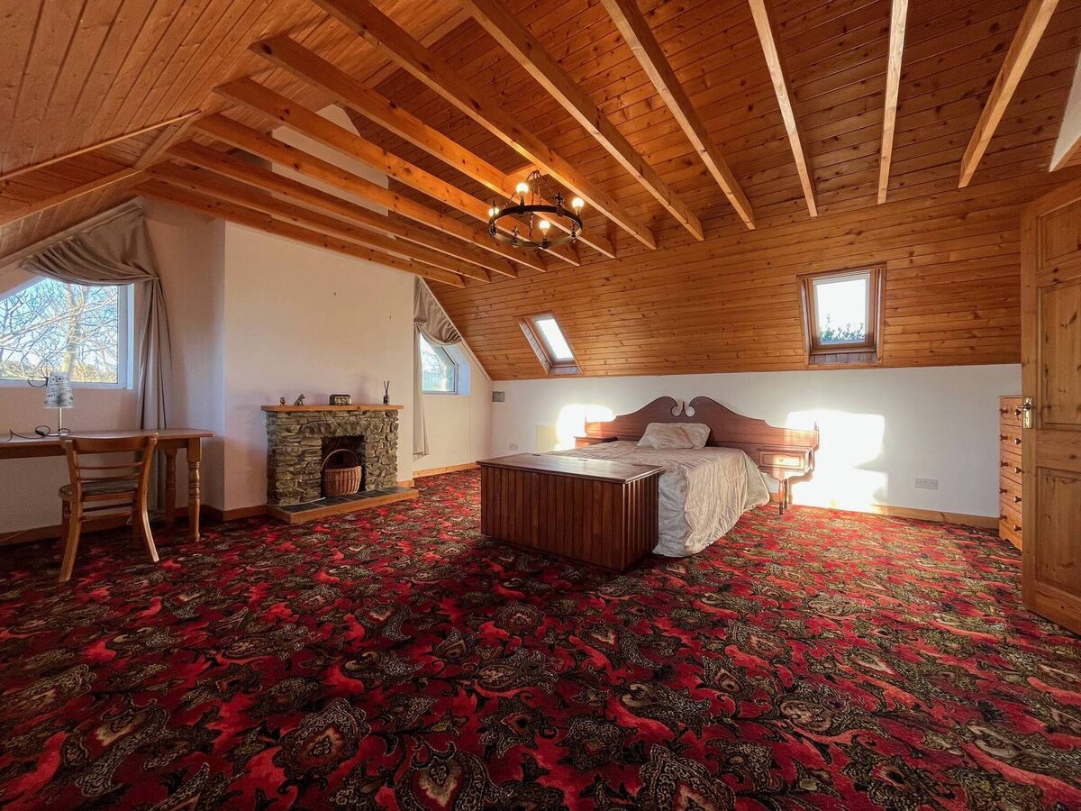 Bright bedroom with views and fireplace