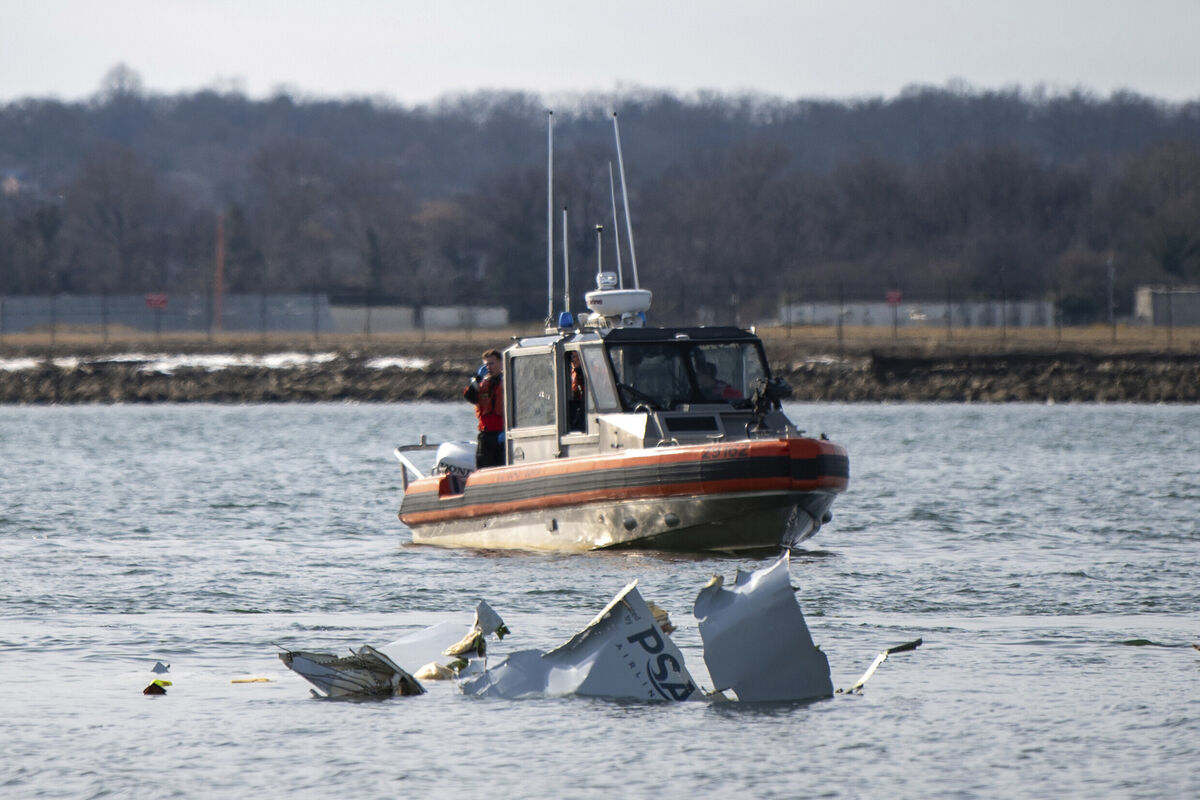 In this photo provided by the U.S. Coast Guard, response boat crews from Coast Guard stations Washington, Curtis Bay, Annapolis, Oxford and Crisfield enforce a safety zone around a wreckage site in the Potomac River from Ronald Reagan Washington National Airport, Thursday, Jan. 30, 2025, in Washington. (Petty Officer 2nd Class Taylor Bacon/U.S. Coast Guard via AP)