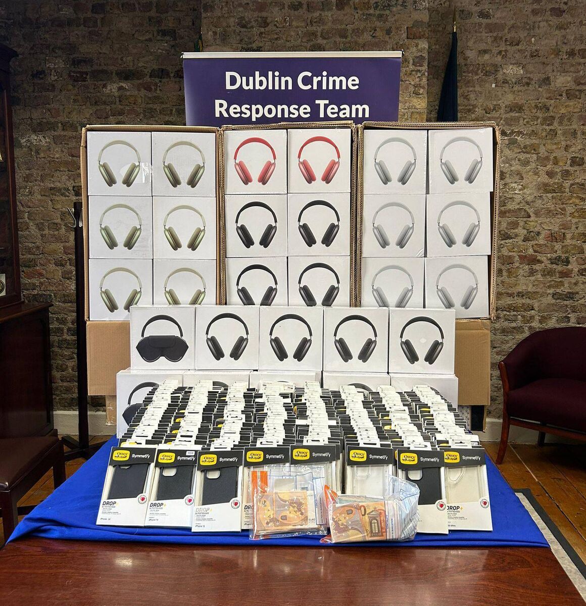 Among the items gardaí seized were 180 suspected counterfeit Apple Air Pod Max headphones and 185 suspected fake Otterbox phone cases. Between them, they would represent a revenue loss of about €110,000. Picture: An Garda Síochána