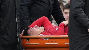 <p>SERIOUS: Manchester United's Lisandro Martinez leaves the pitch on a stretcher. Pic: Martin Rickett/PA Wire.</p>