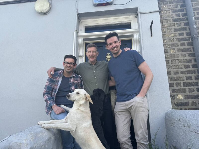 Dermot Bannon with homeowners Cal Moran and Sean Hegarty and their dogs Missy and Trixie.