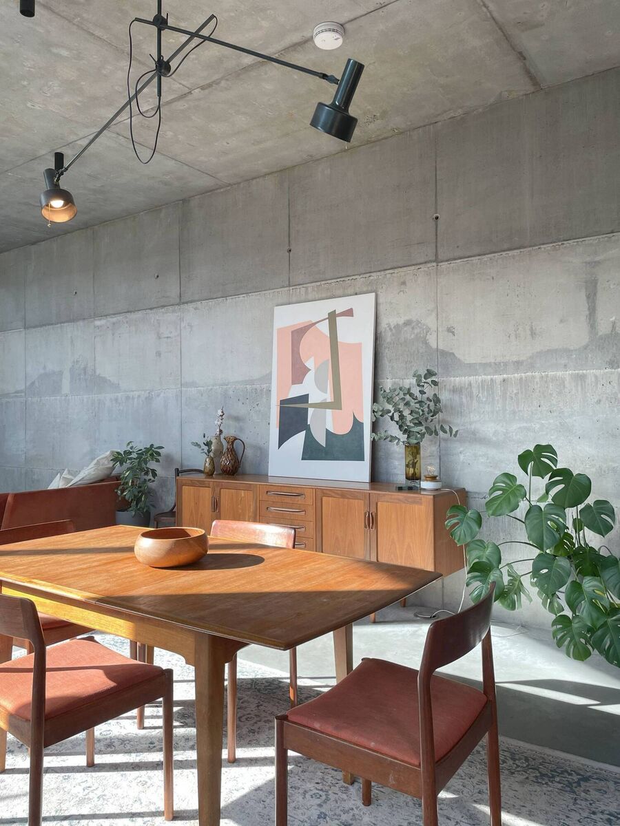 Stephanie O'Sullivan's open-plan dining and living area with mid-century-style furniture.