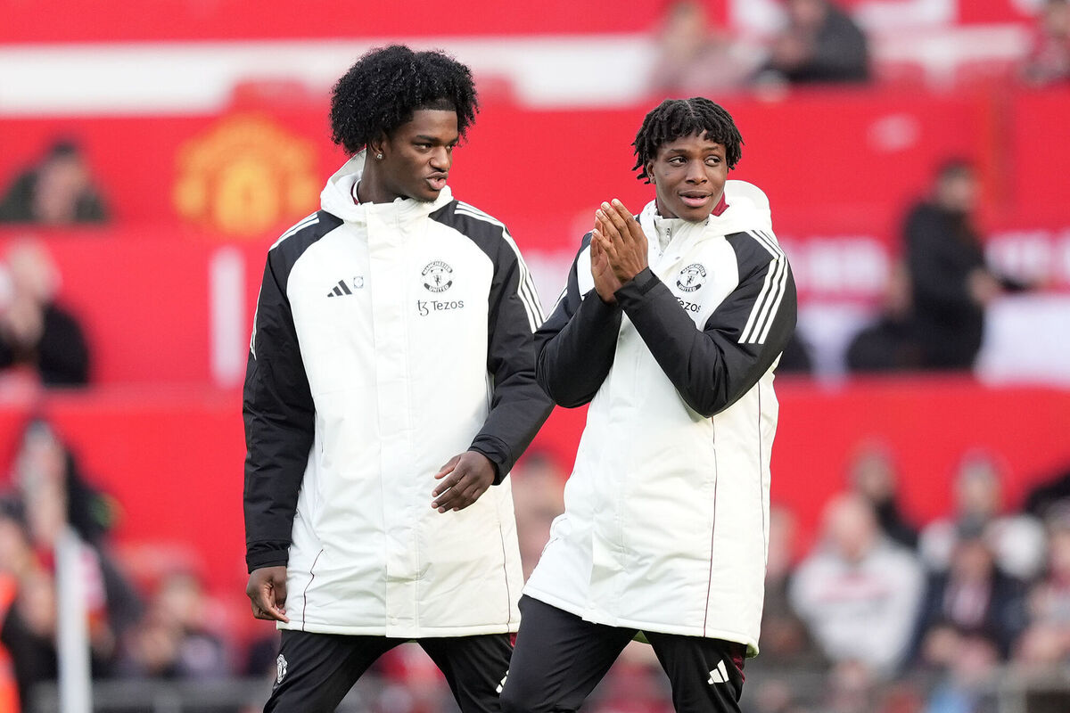 Patrick Dorgu and Ayden Heaven are introduced to the crowd ahead of the Premier League match against Crystal Palace at Old Trafford. Pic: Martin Rickett/PA Wire.