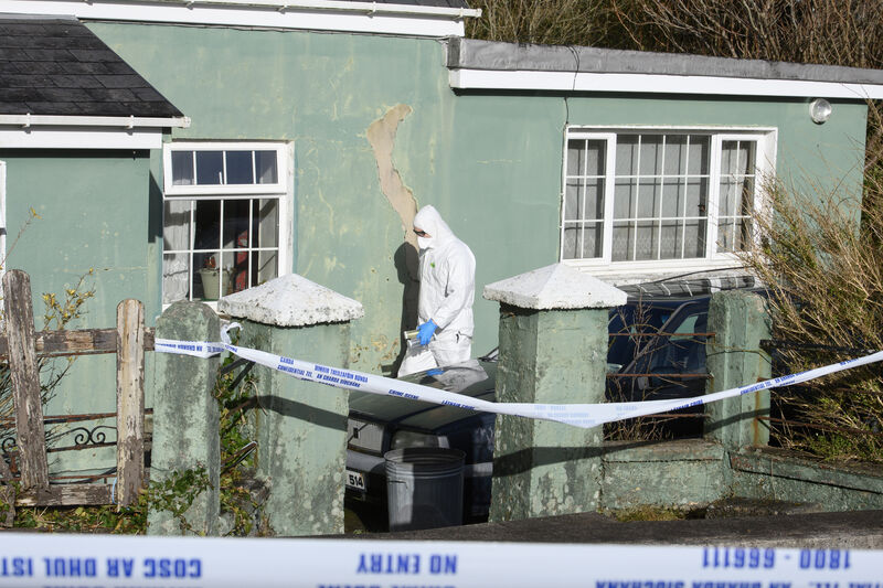  A member of the Garda forensic team in the house where the bodies of Hazel and David Byrne were discovered in the village of Mountain Stage, Glenbeigh, Co Kerry. Picture: Dan Linehan