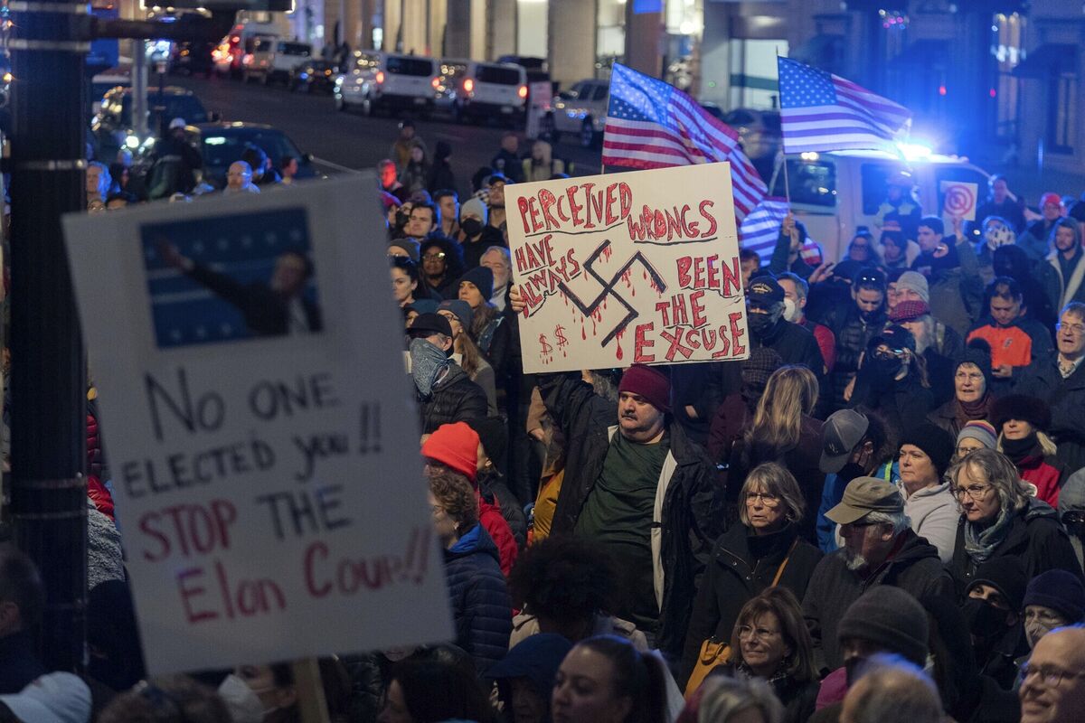 People protest during a rally against Elon Musk outside the Treasury Department in Washington. Picture: Jose Luis Magana People protest during a rally against Elon Musk outside the Treasury Department in Washington. Picture: Jose Luis Magana