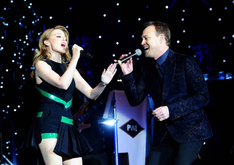 Kylie Minogue and Jason Donovan perform during the Hit Factory Live Christmas Cracker concert. reuniting their much-loved double-act.