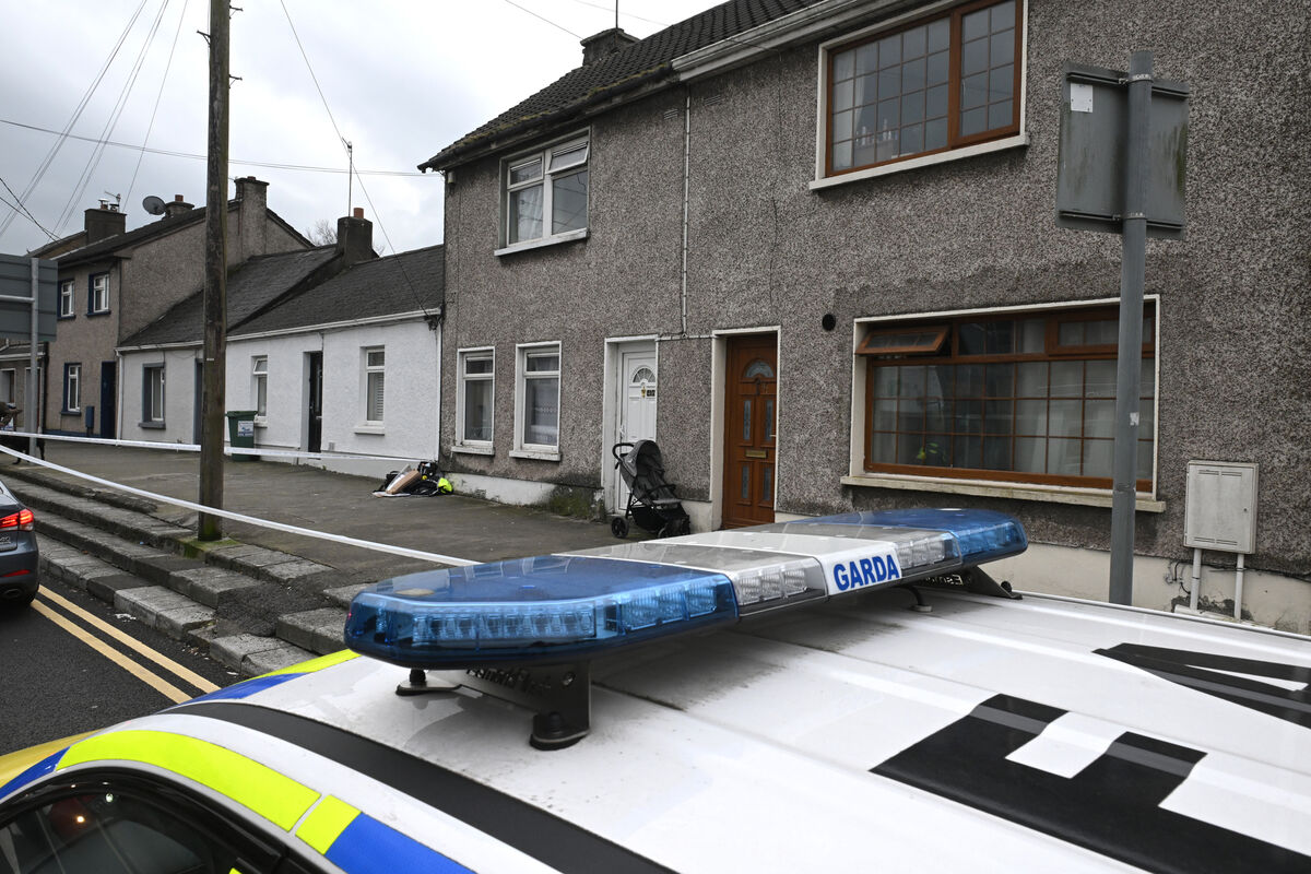  The Gardai cornered off the area outside this house on Evergreen Road after a woman was stabbed. Picture Dan Linehan