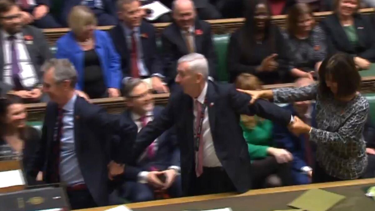 Lindsay Hoyle (centre) is dragged to the speaker&rsquo;s chair (House of Commons/PA)