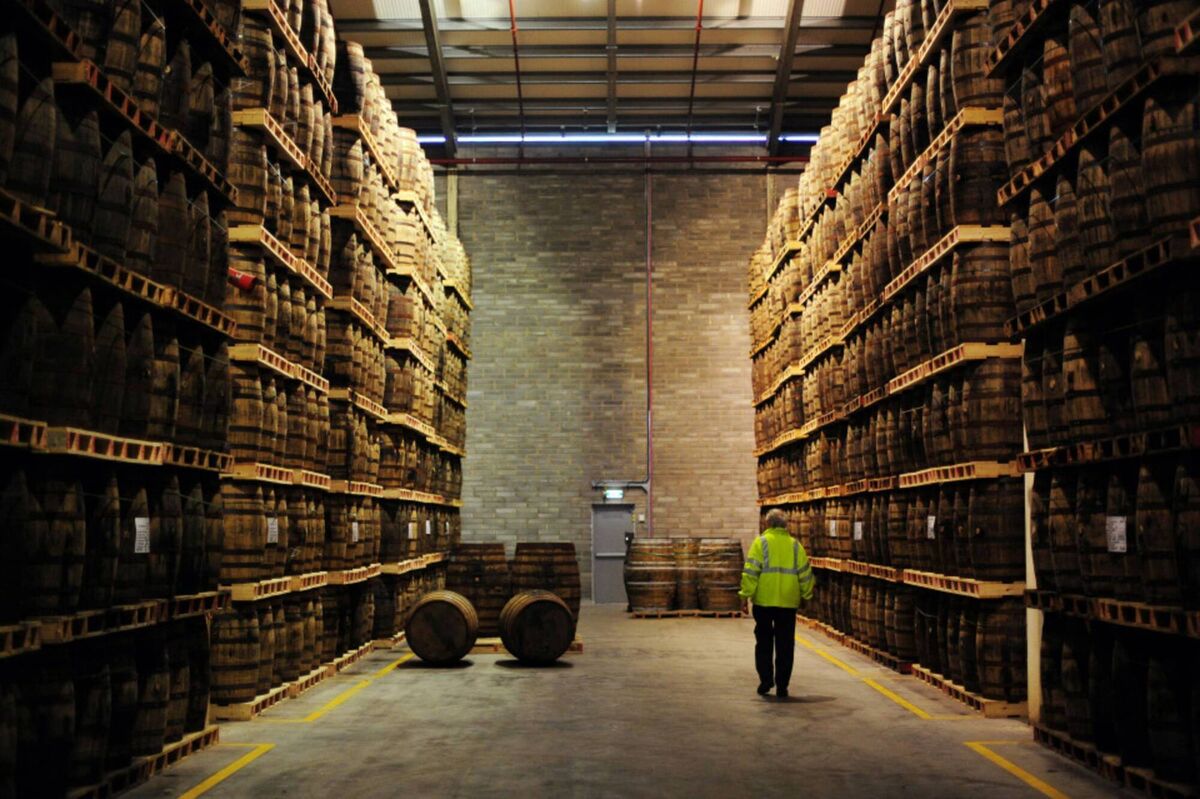 An employee passes American oak barrels containing Jameson whiskey, produced by Irish Distillers Ltd., at the Pernod-Ricard SA distillery in Middleton, Ireland. An employee passes American oak barrels containing Jameson whiskey, produced by Irish Distillers Ltd., at the Pernod-Ricard SA distillery in Middleton, Ireland.