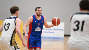 <p> Kyle Hosford with possession for UCC Demons at Mardyke Arena. Pic Larry Cummins</p>