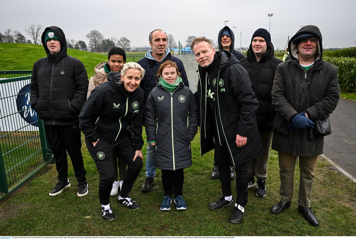 Head coach Carla Ward, left, and assistant head coach Alan Mahon, right, with members of the Prosper Fingal Rush Football For All team, including Kim Doyle, centre, after a Republic of Ireland women's training session at the FAI National Training Centre in Abbotstown, Dublin. Photo by Stephen McCarthy/Sportsfile Photo by Stephen McCarthy/Sportsfile Head coach Carla Ward, left, and assistant head coach Alan Mahon, right, with members of the Prosper Fingal Rush Football For All team, including Kim Doyle, centre, after a Republic of Ireland women's training session at the FAI National Training Centre in Abbotstown, Dublin. Photo by Stephen McCarthy/Sportsfile Photo by Stephen McCarthy/Sportsfile