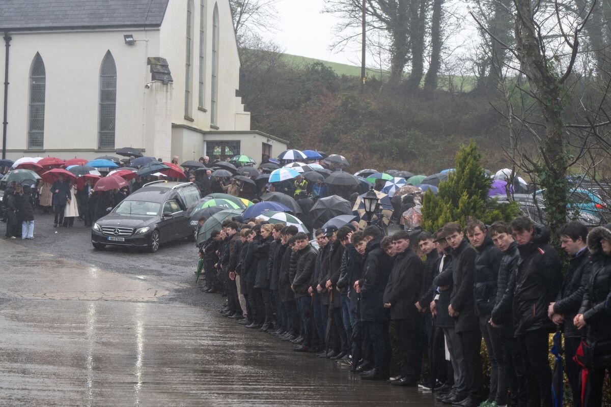 Mourners line the road to St John’s Baptist Church in Lombardstown, Co Cork as a mark of respect for jockey Michael O'Sullivan. Picture: Chani Anderson