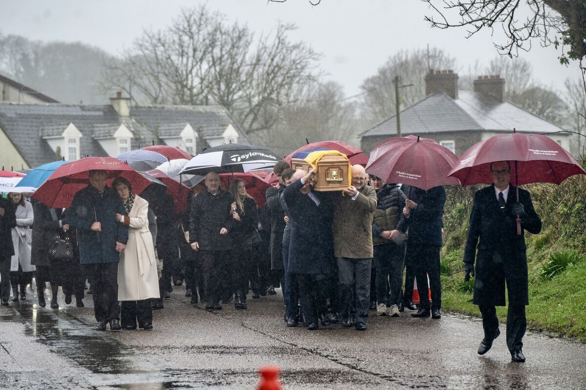 Friends and family carry the coffin of Michael O'Sullivan’s during his funeral procession in Lombardstown, Co Cork. Picture: Chani Anderson