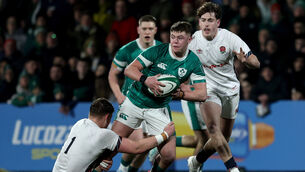 <p>Ireland's Eoghan Smyth is tackled by Nic Allison of England. Pic: Andrew Conan/Inpho</p>