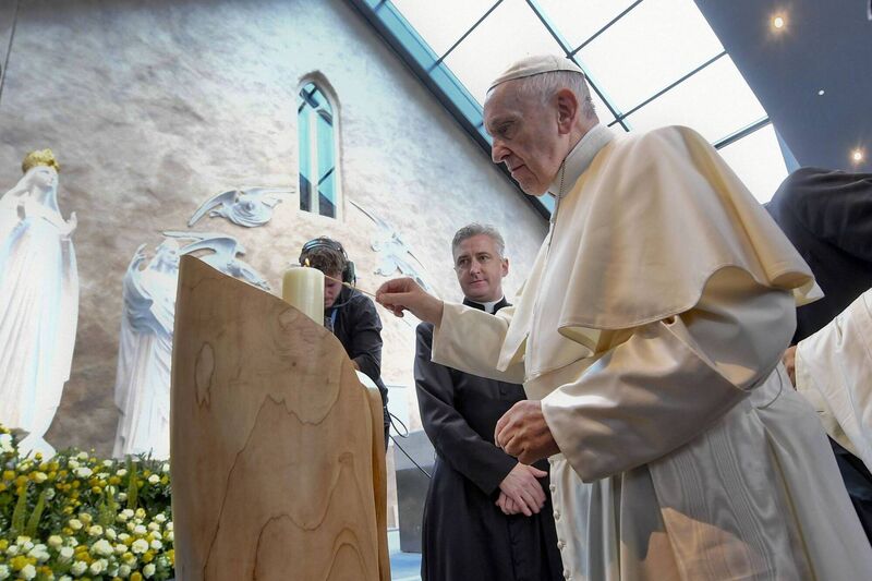 Pope Francis lights a candelat the Knock Shrine, in Knock, County Mayo on August 26, 2018, during his visit to Ireland to attend the 2018 World Meeting of Families. Picture: Ciro FUSCO / POOL / AFP Pope Francis lights a candelat the Knock Shrine, in Knock, County Mayo on August 26, 2018, during his visit to Ireland to attend the 2018 World Meeting of Families. Picture: Ciro FUSCO / POOL / AFP