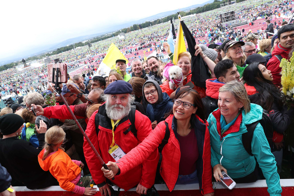 People attend Pope Francis' closing Mass at the World Meeting of Families in Dublin's Phoenix park.