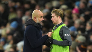 <p>Manchester City manager Pep Guardiola (left) speaks with Kevin De Bruyne. Pic: Martin Rickett/PA</p>