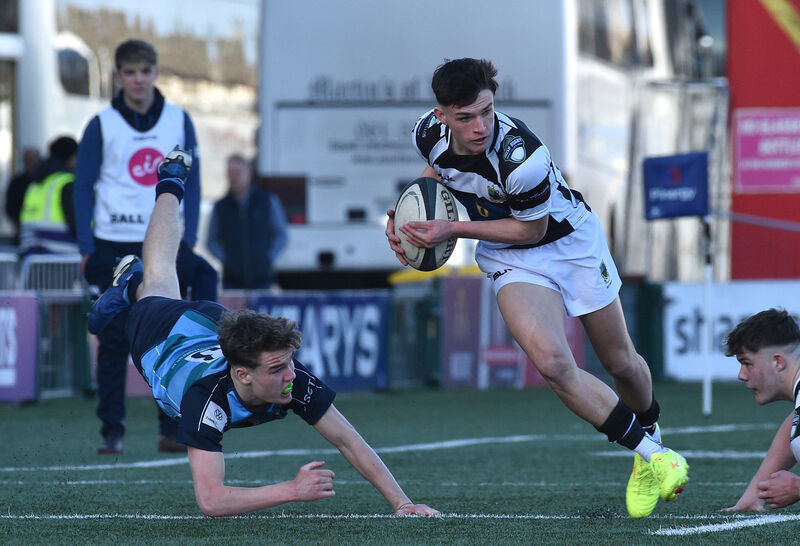  Bobby O'Callaghan, PBC, Cork breaking the tackle of Seán Lyons, Castletroy College in the Pinergy Munster Schools Senior Cup semi-final at Virgin Media Park, Cork. Picture Dan Linehan