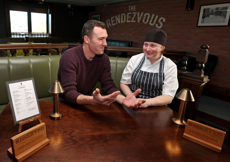 The business duo discuss the new menu at The Rendezvous. Picture: Jim Coughlan The business duo discuss the new menu at The Rendezvous. Picture: Jim Coughlan