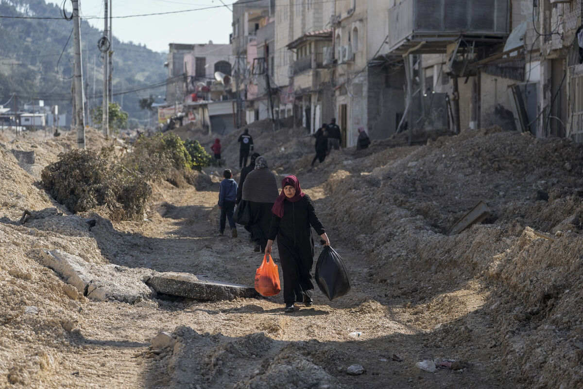 Residents of the West Bank urban refugee camp of Nur Shams evacuate their homes and carry their belongings as the Israeli military continues its operation in the area on Wednesday Picture; AP Photo/Majdi Mohammed