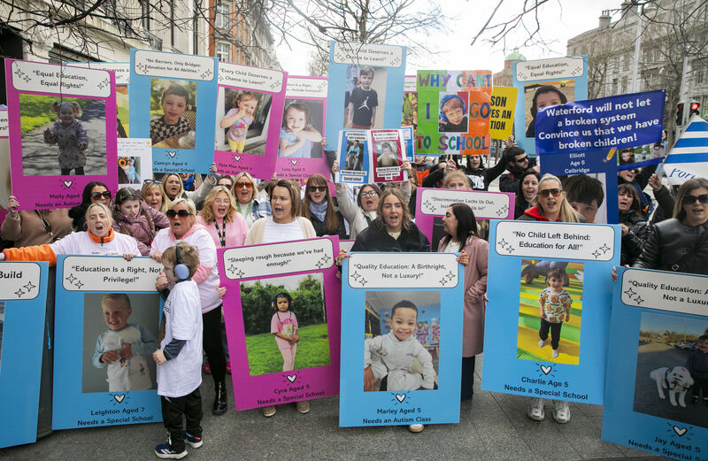 Parents, families, and friends of children during a march to the Department of Education protesting over special education needs placements. Picture: Gareth Chaney Parents, families, and friends of children during a march to the Department of Education protesting over special education needs placements. Picture: Gareth Chaney