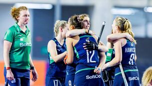 <p>Ireland’s Katie Mullan embraces teammate Elena Neill after the penalty shootout. Pic: Rodrigo Jaramillo, Worldsportpics</p>