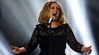 Photo-shy Adele earns £80,000 a day while preparing third album